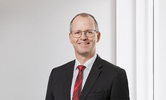 Portraitfoto von Adrian Kunz, Leiter Generalsekretariat bei der St.Galler Kantonalbank