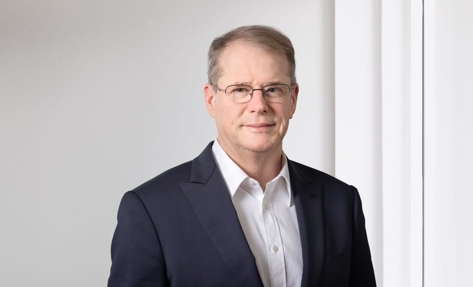 Portraitfoto von Christian Schmid, Präsident der Geschäftsleitung der St.Galler Kantonalbank